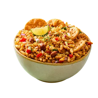 A bowl of bhel puri garnished with a lime wedge and papdi, isolated on a solid grey background.