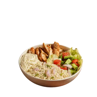 A Mediterranean-style chicken bowl containing couscous, grilled chicken, hummus, and a fresh salad, isolated on a solid grey background.