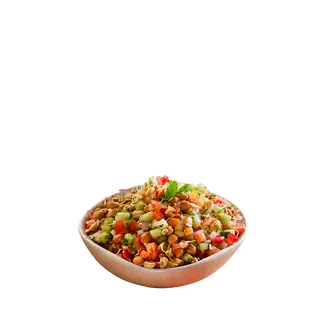A bowl of fresh sprouts salad mixed with chopped tomatoes, cucumbers, and peanuts, isolated on a solid grey background.